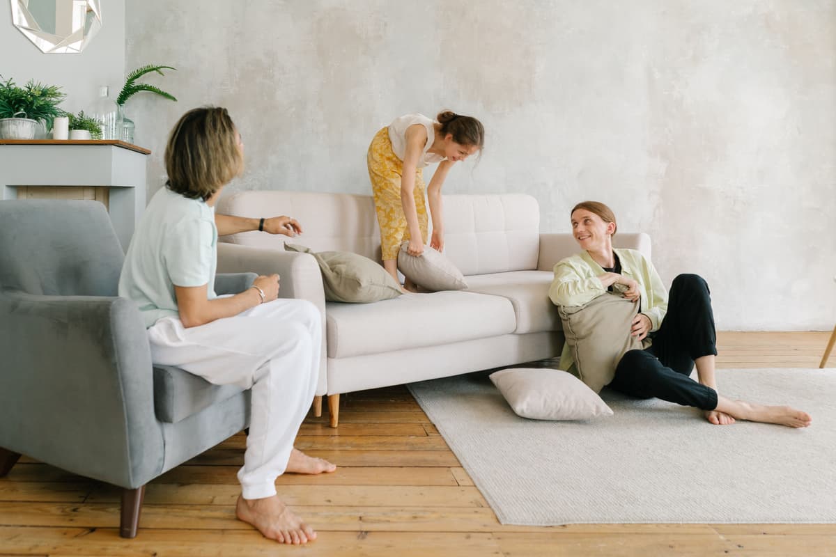 family group posing, living room, natural light, candid